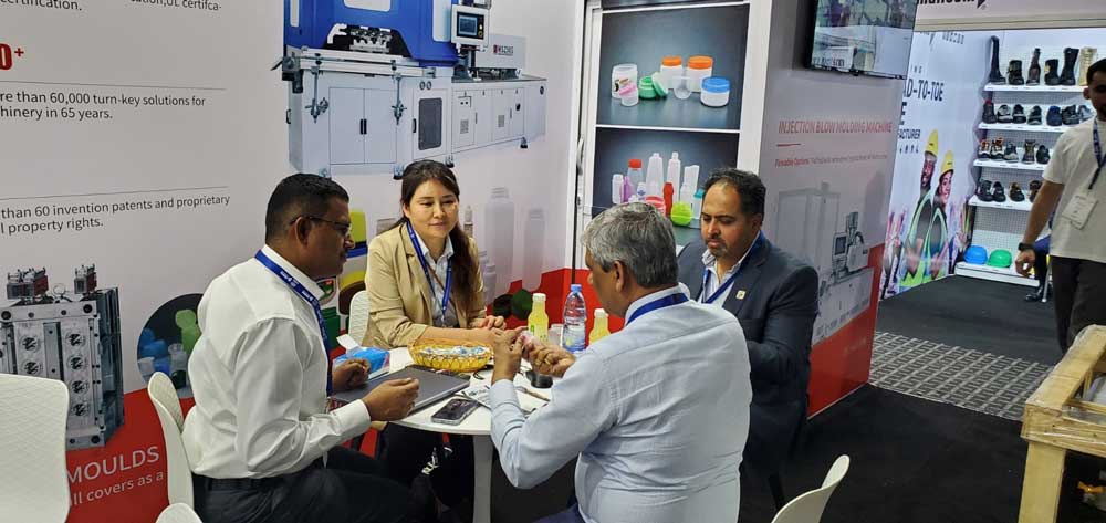 Customer discussion at Victor Machinery booth